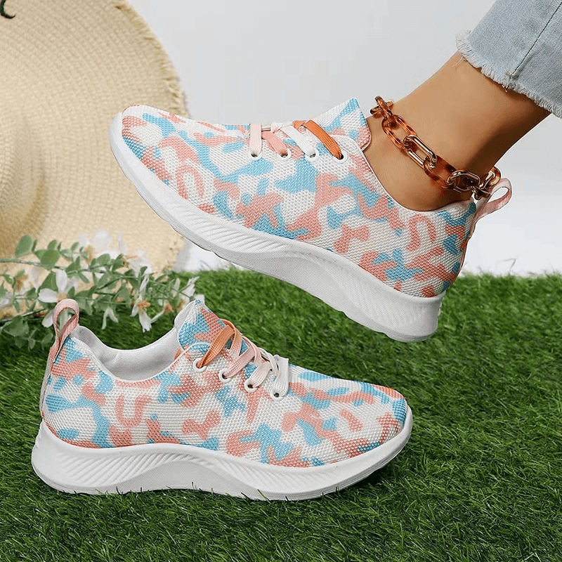 Women's breathable camouflage mesh non-slip sports shoes SF1406, featuring lace-up closure and rubber soles, displayed on grass.